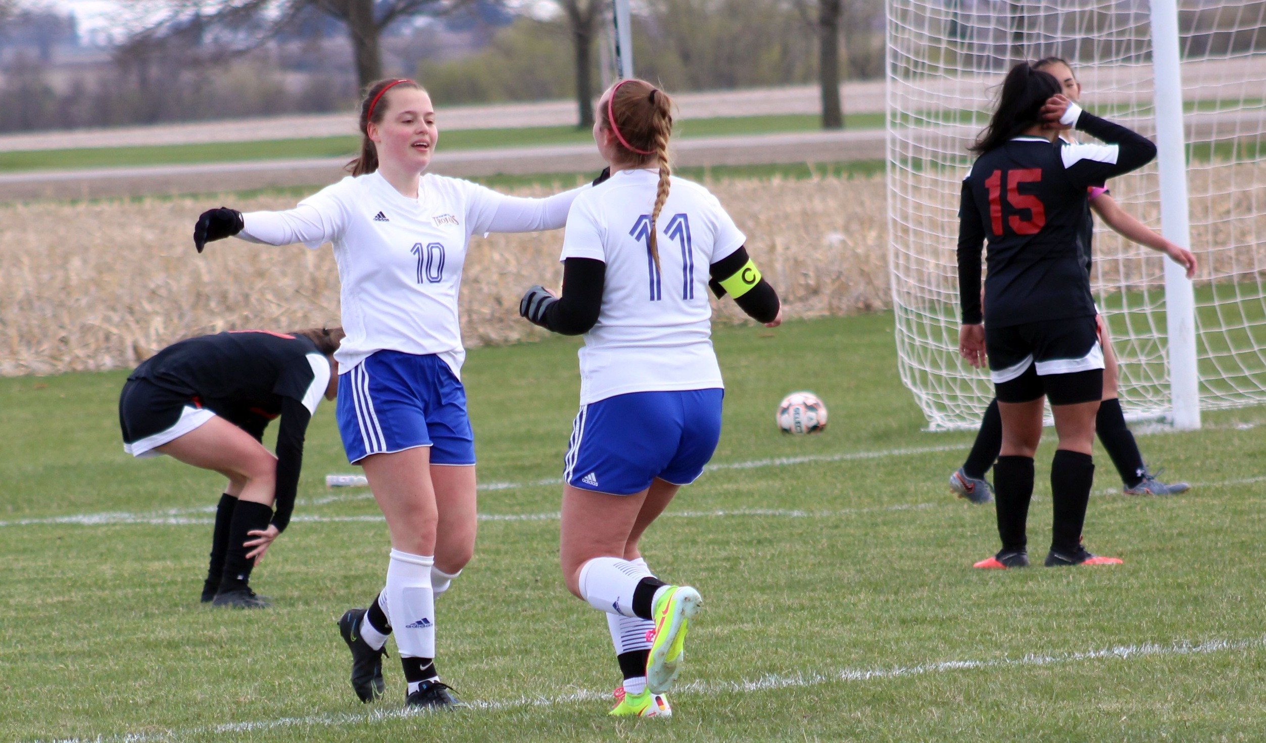 NIACC's Sophia Gebl (11) celebrates with Celine Witt after Witt's goal gave NIACC a 2-0 lead in first half of Monday's match against Southeastern.