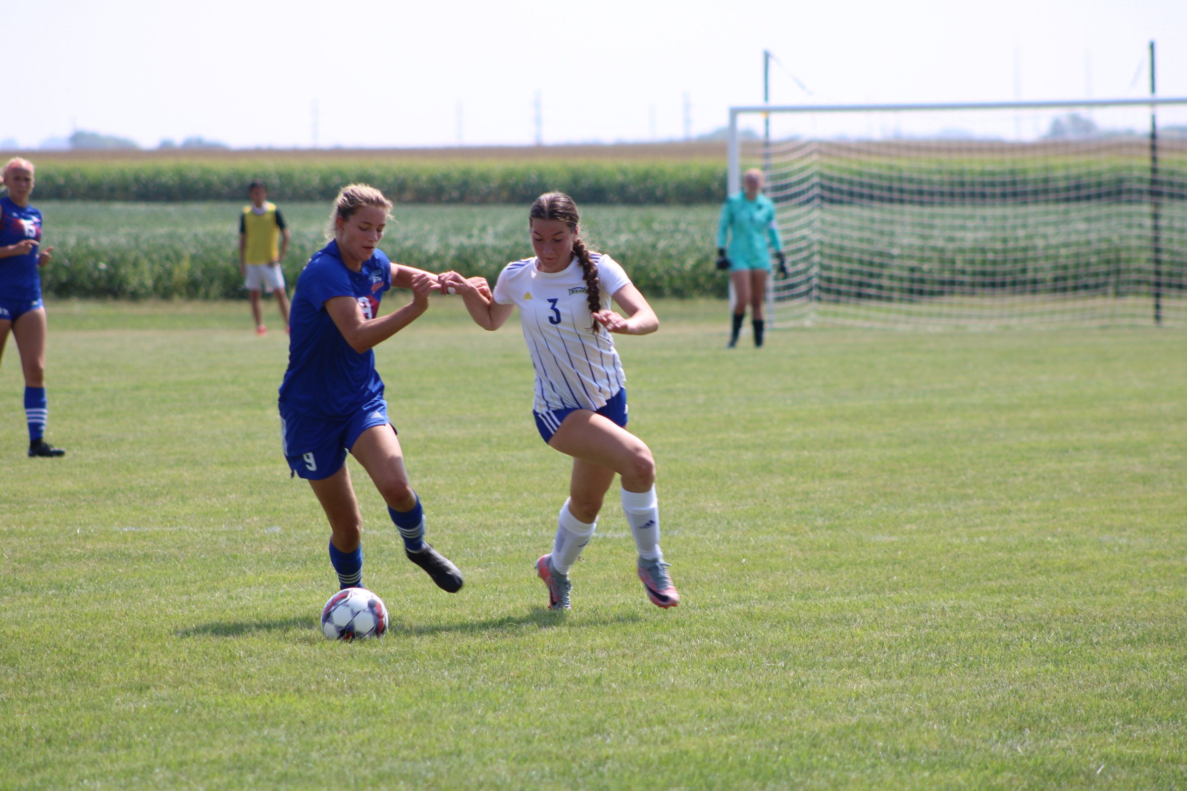 NIACC's Karly Holm (3) battles for the ball during Wednesday's home soccer match against Hawkeye CC.