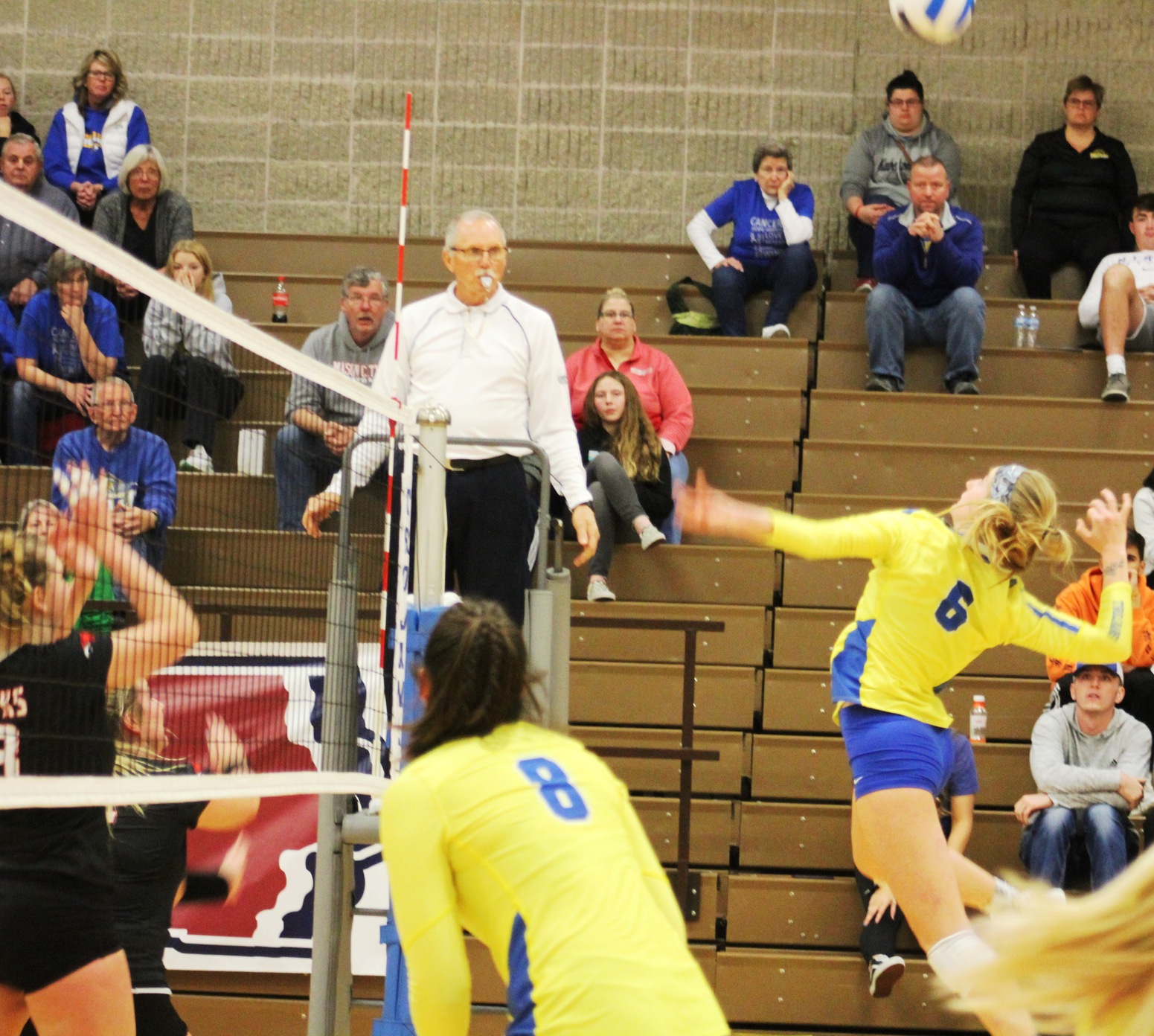 Kennedy Meister hits the ball over the net in Sunday's regional title match against Northeast CC.