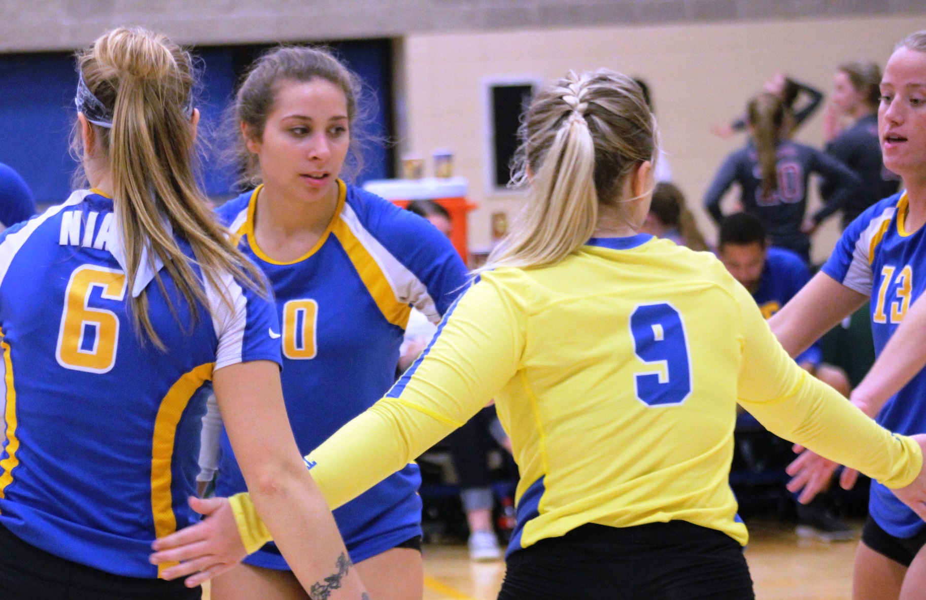 NIACC players celebrate a point in last weekend's NIACC volleyball tournament.