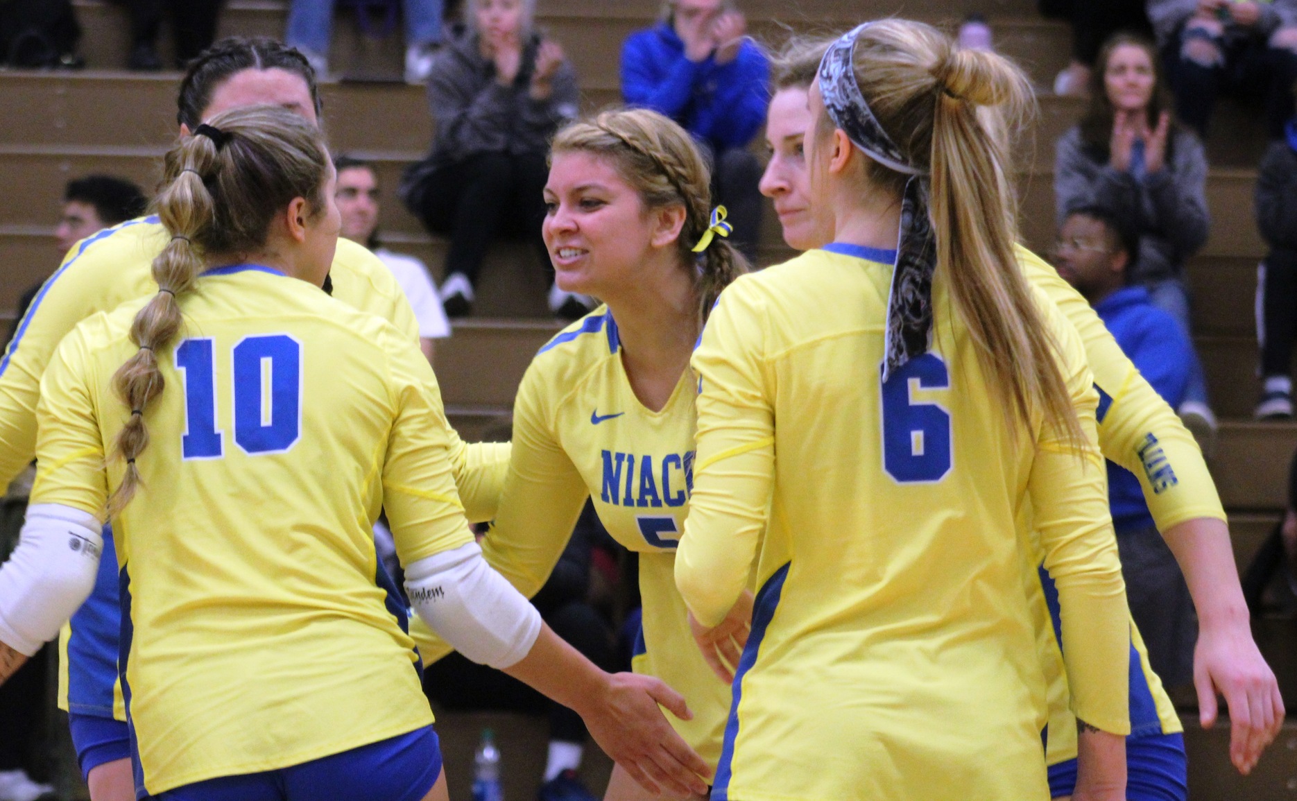 NIACC players celebrate a point in Saturday's regional tournament match against Southeastern.