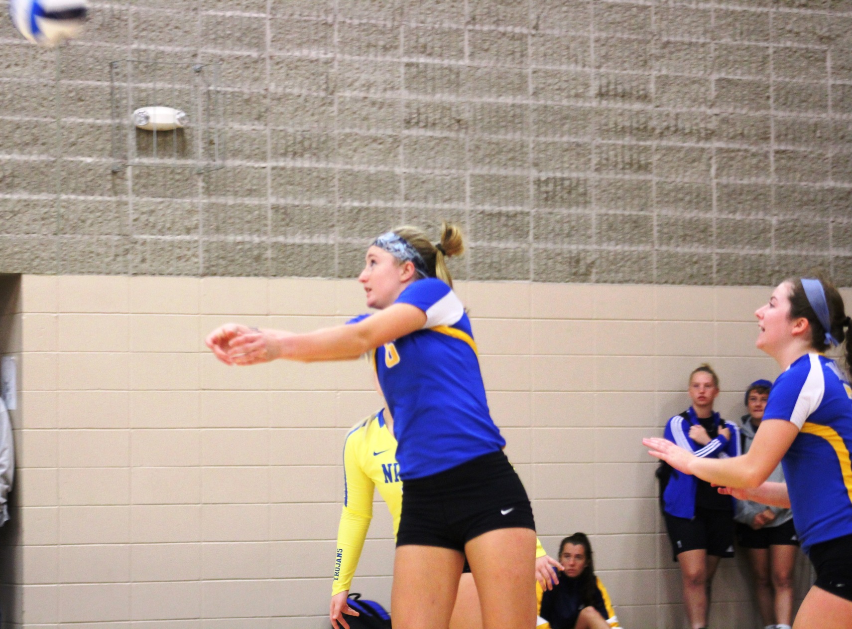 NIACC's Kennedy Meister bumps the ball over the net in Friday's match against Dakota College-Bottineau.