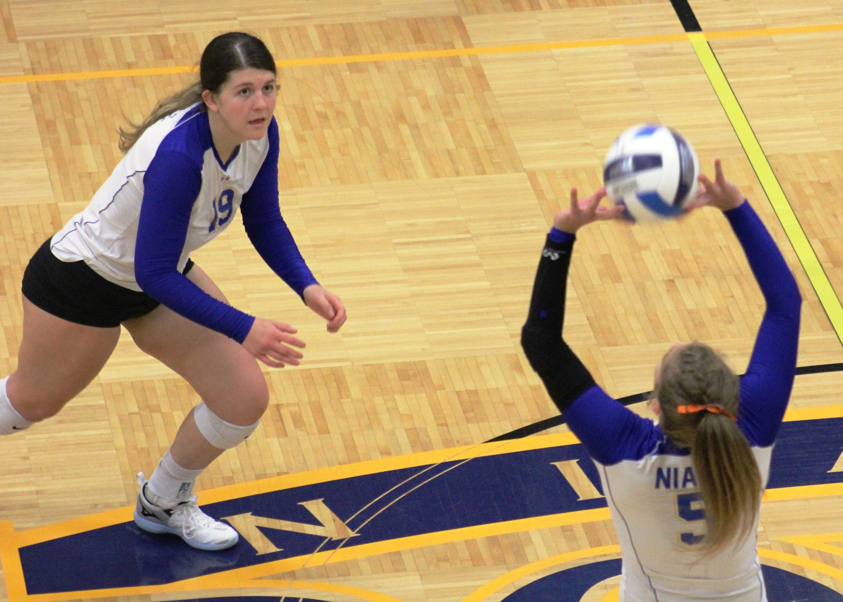 NIACC's Becca Steffen sets the ball as Braylee Wood looks on during Friday's match against DCTC.