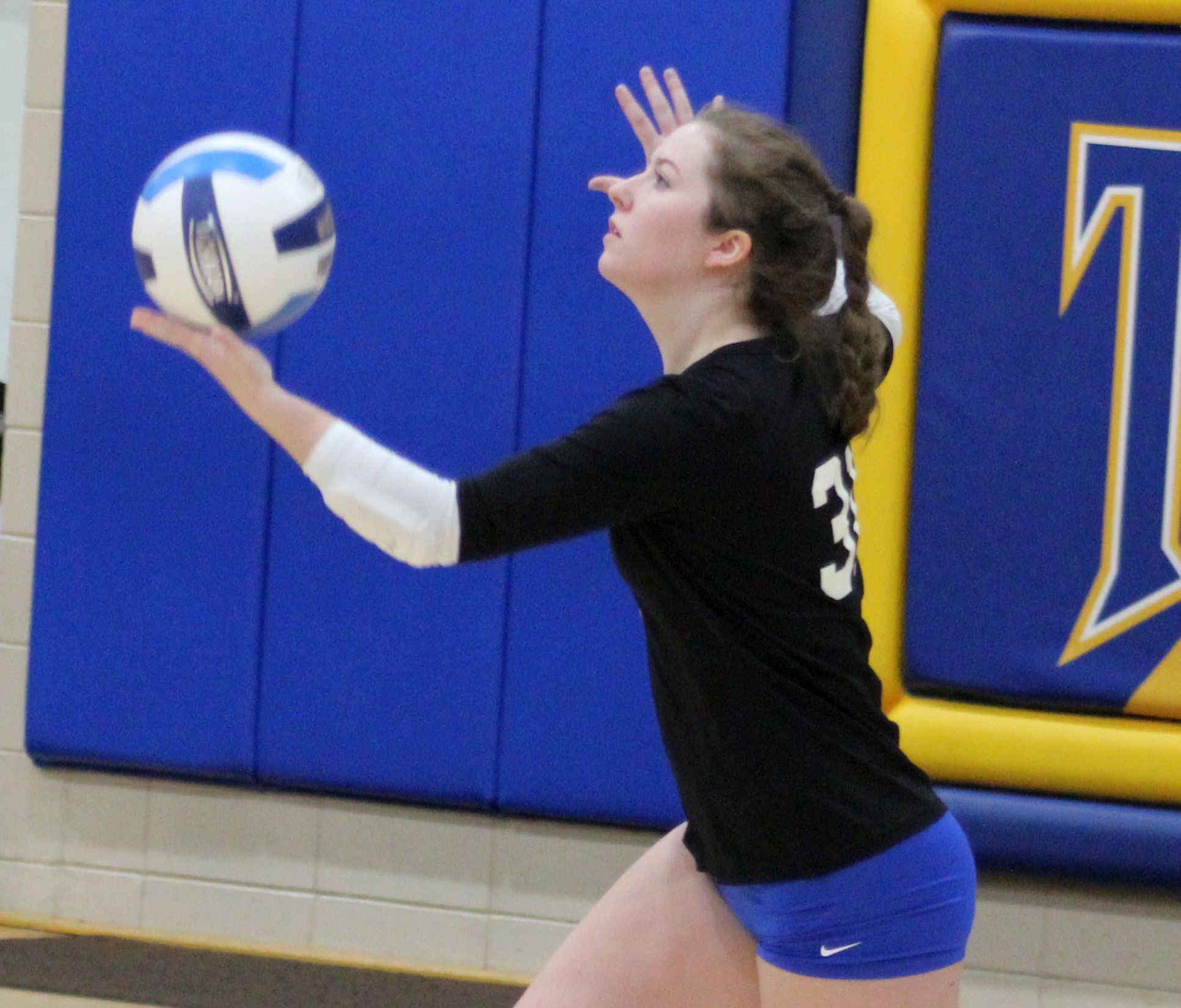 Sophomore Bri Powers serves during Sunday's match against Southwestern.