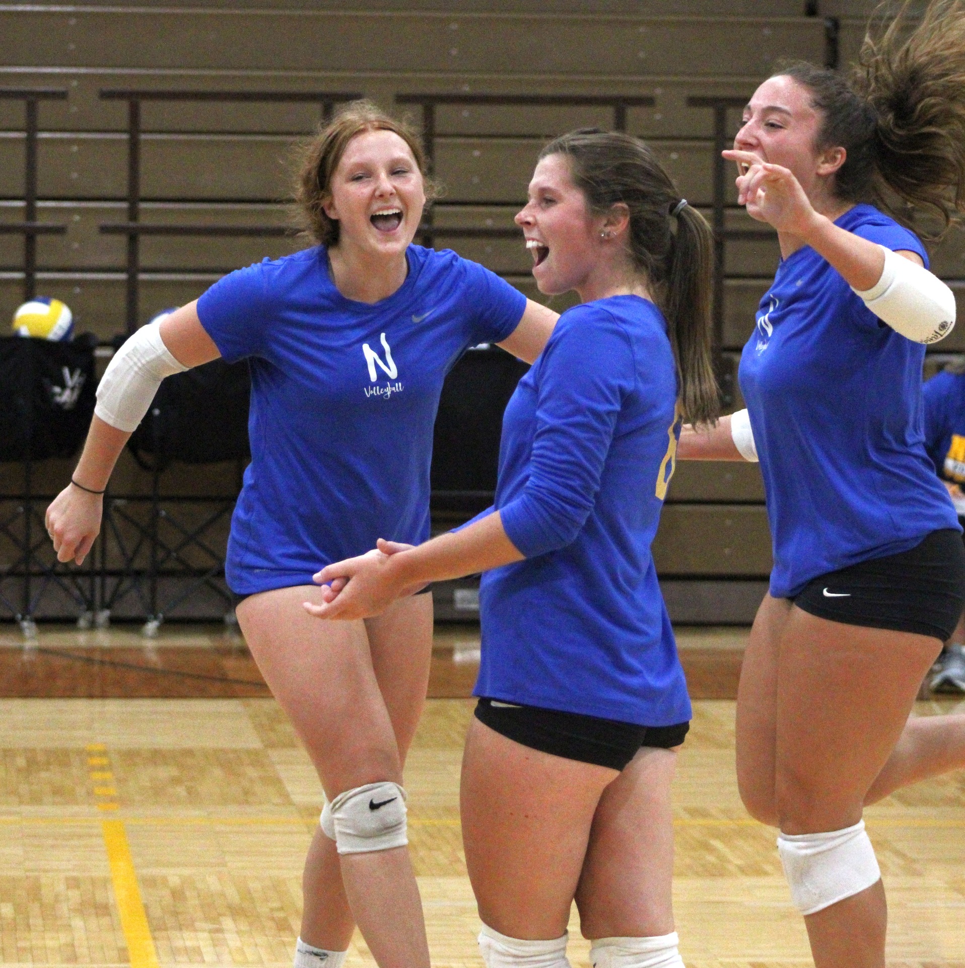 NIACC players celebrate a point in Tuesday's scrimmage against RCTC in the NIACC gym.