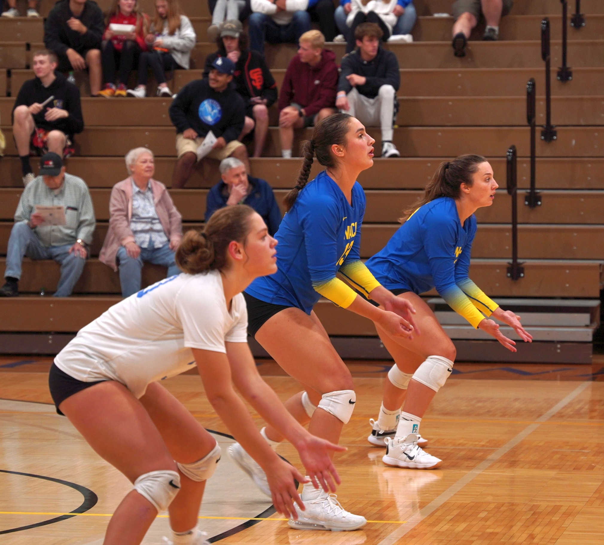 The NIACC back row gets ready for the serve in Friday's home match against the Wartburg College Junior Varsity. Photo by Kaitlyn Davis.