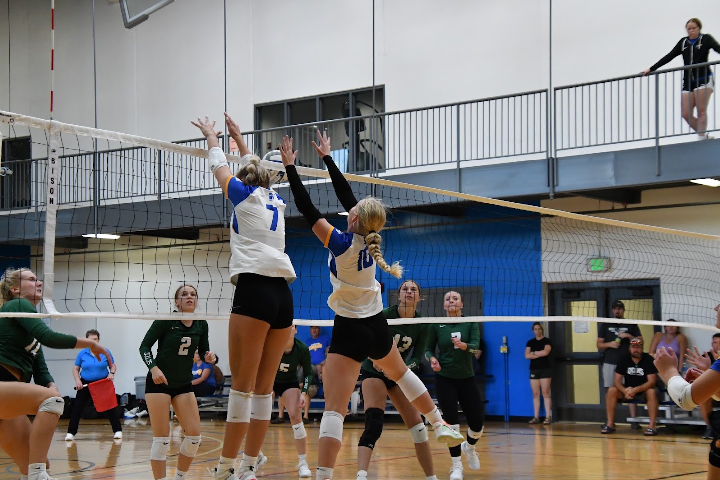 NIACC's Alicia Machacek (7) and Ellie Hanna get the block during Friday's match against St. Cloud Tech and CC at the Anoka-Ramsey Crossover Tournament.