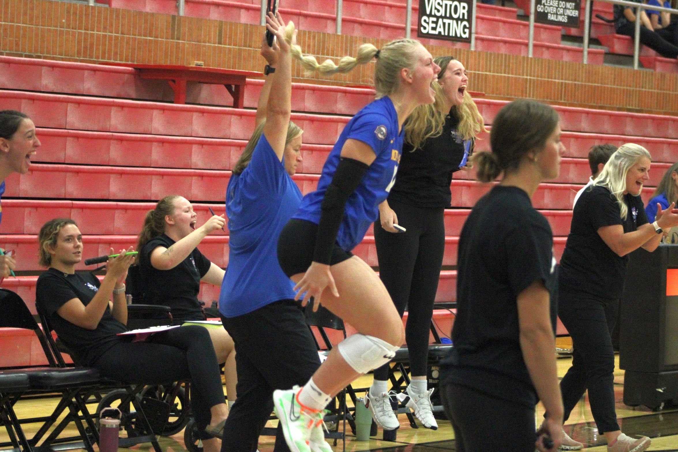 The NIACC bench celebrates a set four win in Friday's match against the Wartburg College Junior Varsity in the NIACC gym. The Trojans won, 3-2.