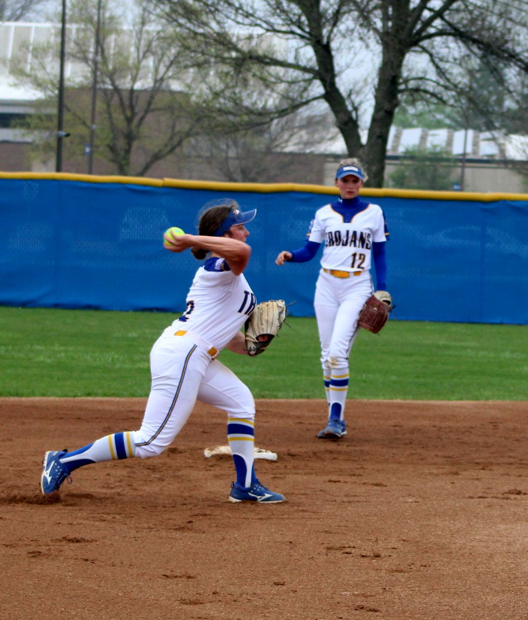 NIACC shortstop Katy Olive throws to first base for the out in Saturday's regional tournament against Iowa Lakes.