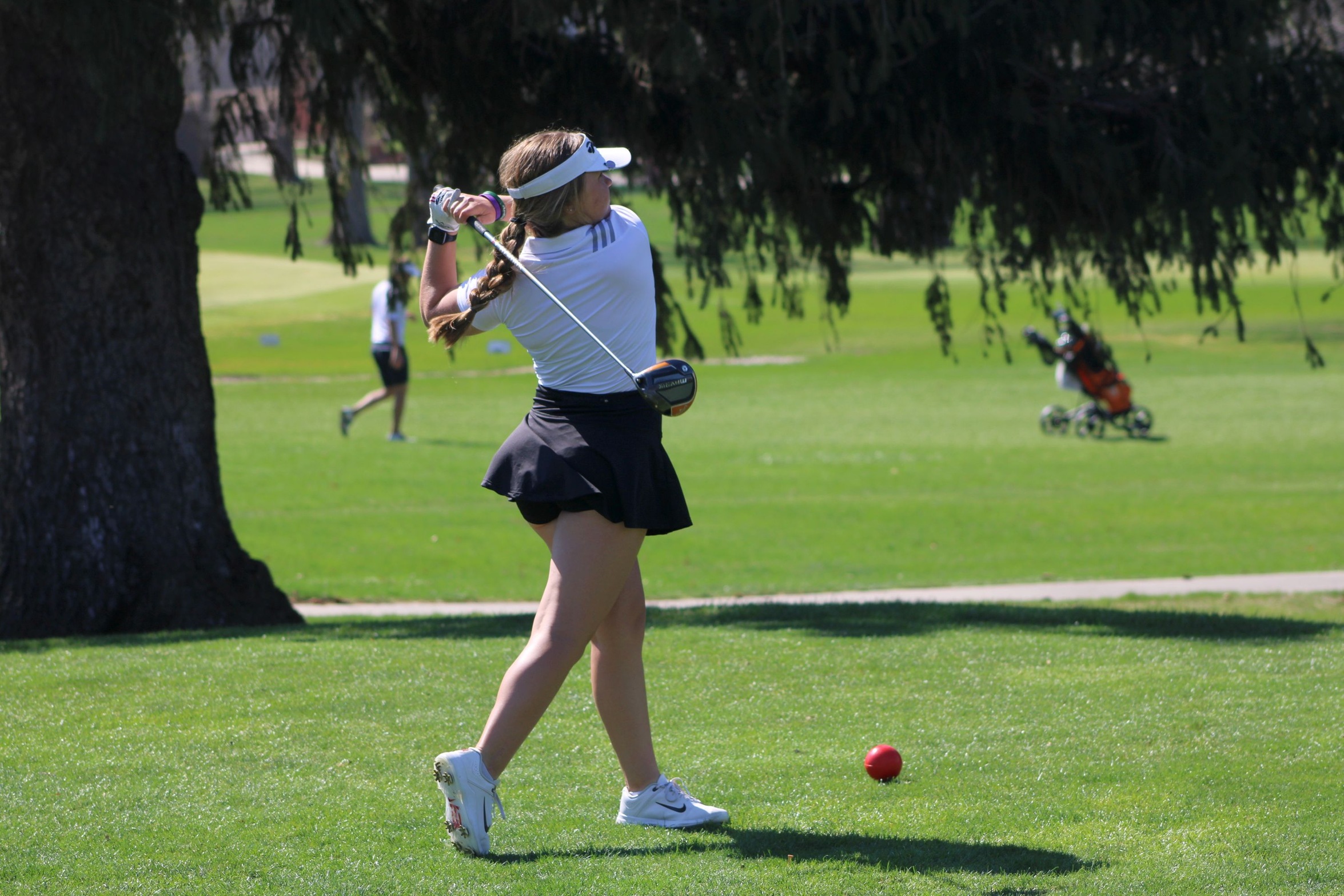 NIACC freshman Emma Weiner tees off Friday at the Battle of Waterloo at the Irv Warren Memorial Golf Course.
