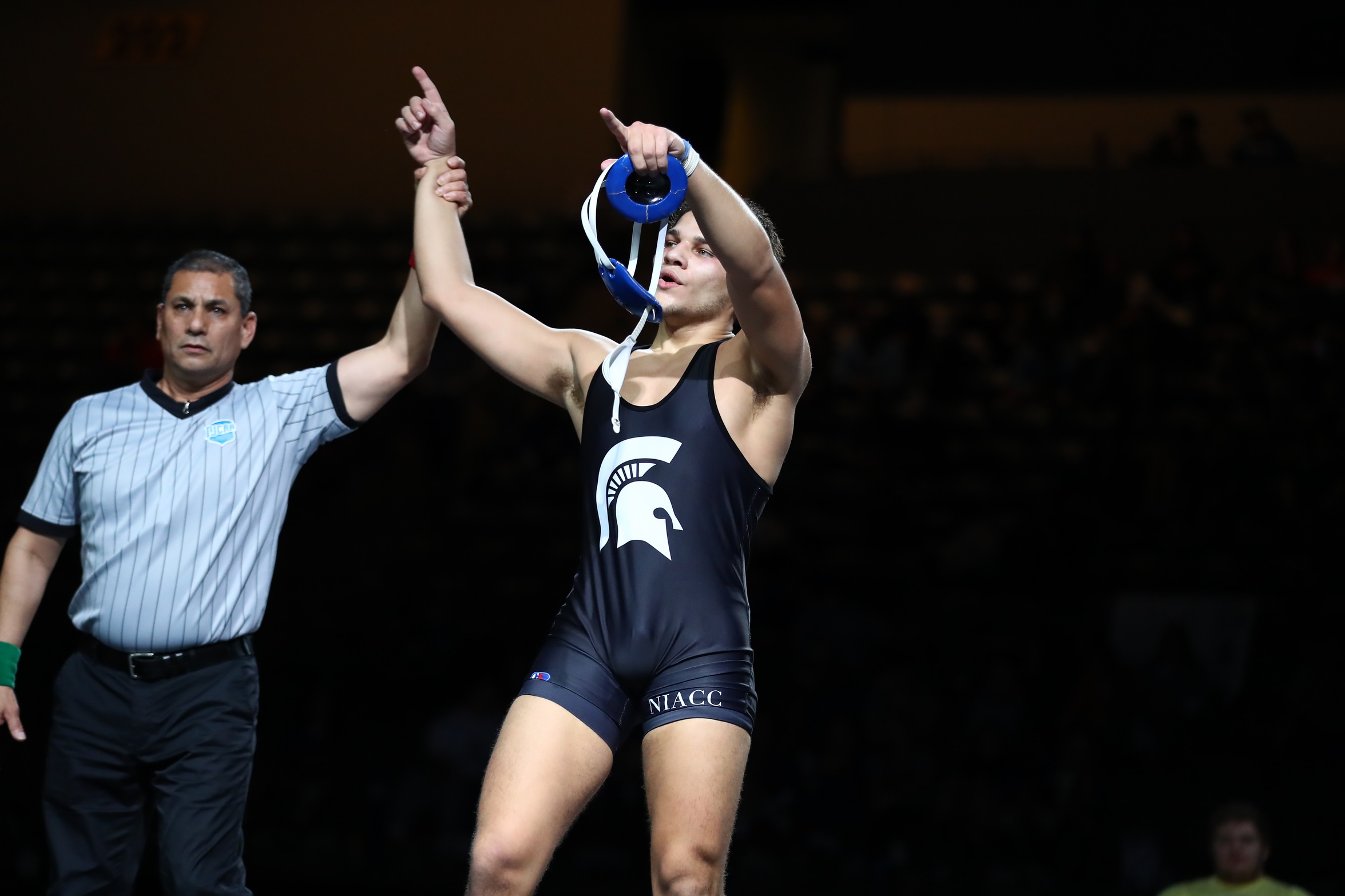 NIACC's Jose Valdez gets his hand raised after claiming the 2022 NJCAA 197-pound national title in Council Bluffs.