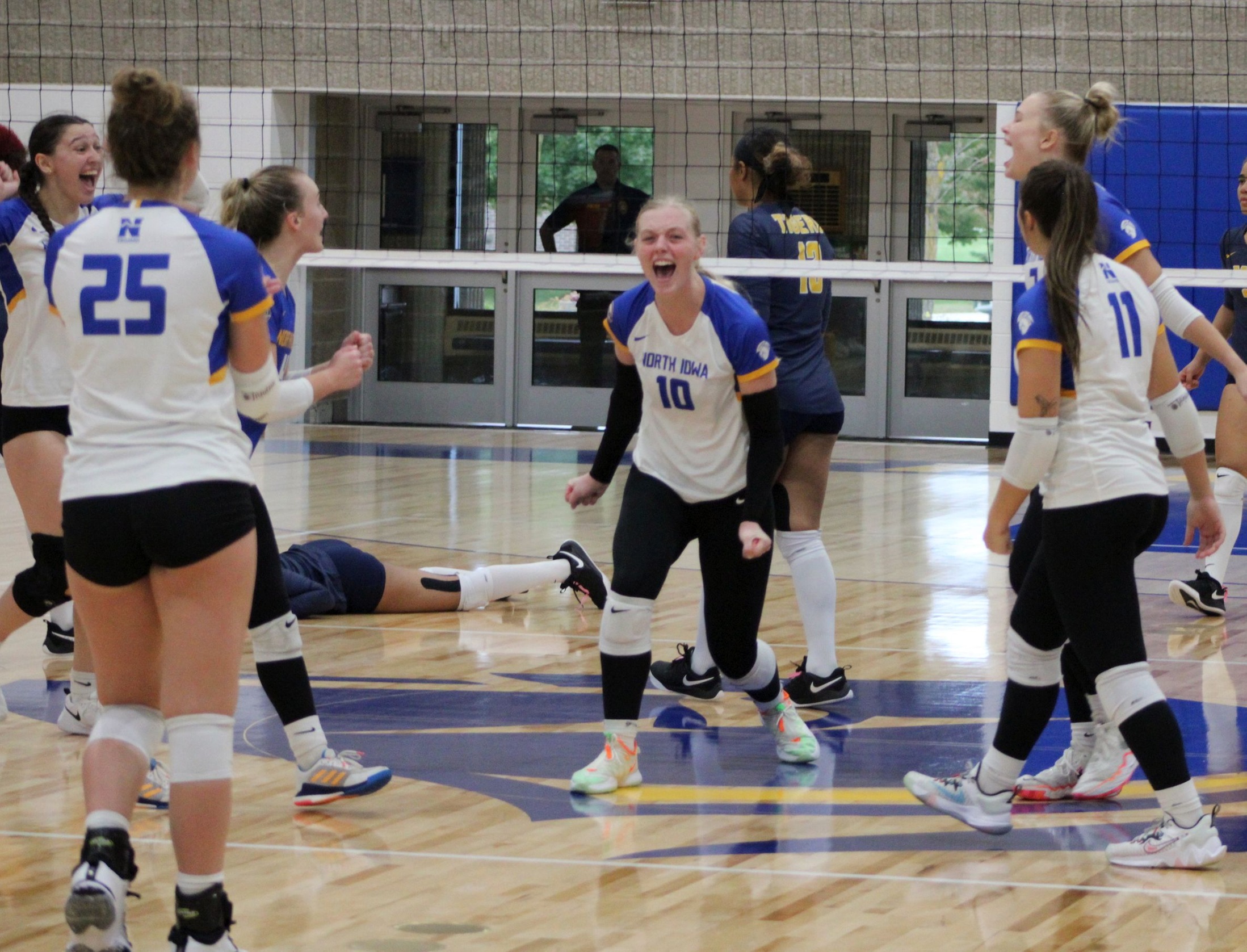NIACC celebrates a point in the fifth set of Saturday's match against Marshalltown CC in the NIACC gym.